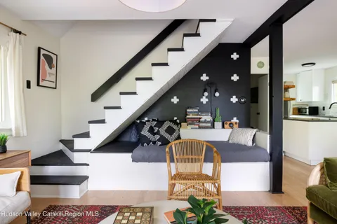 a living room with furniture and flowerpot