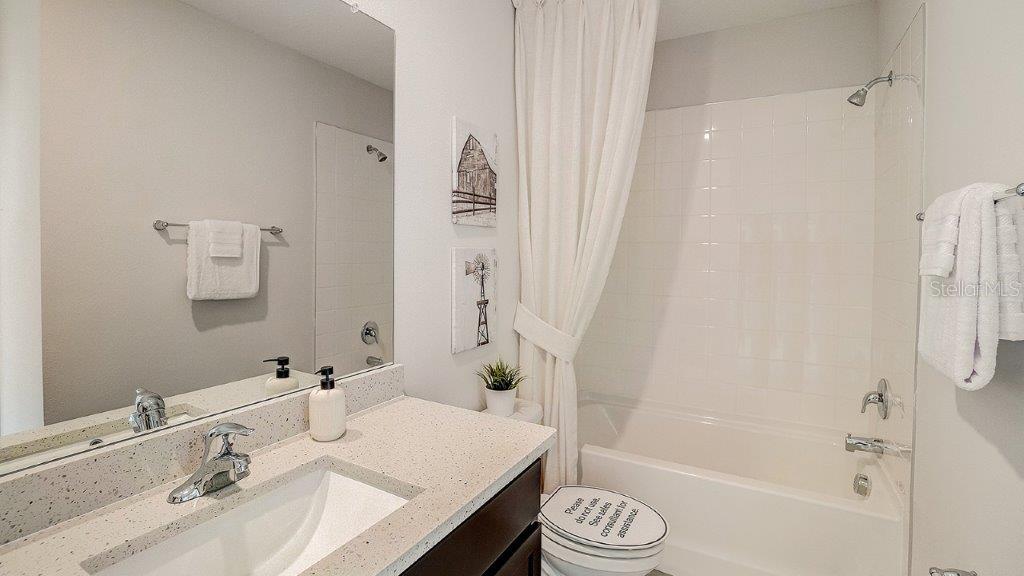 31107 Paper Birch Street Wesley Chapel, FL 33545 - Photo 14 of 15 a bathroom with a sink and a mirror