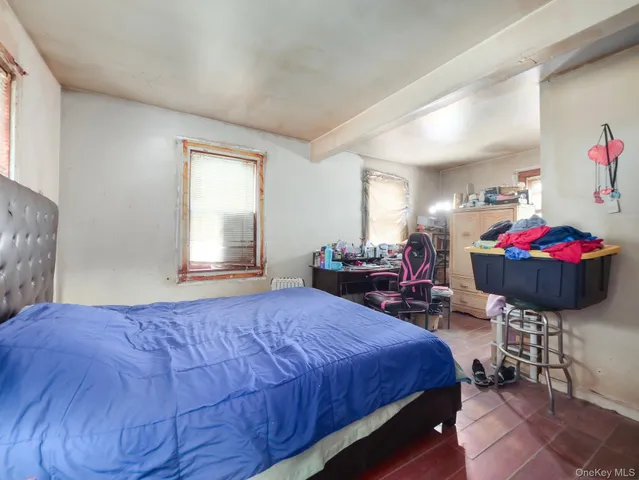 a bedroom with a bed and a table