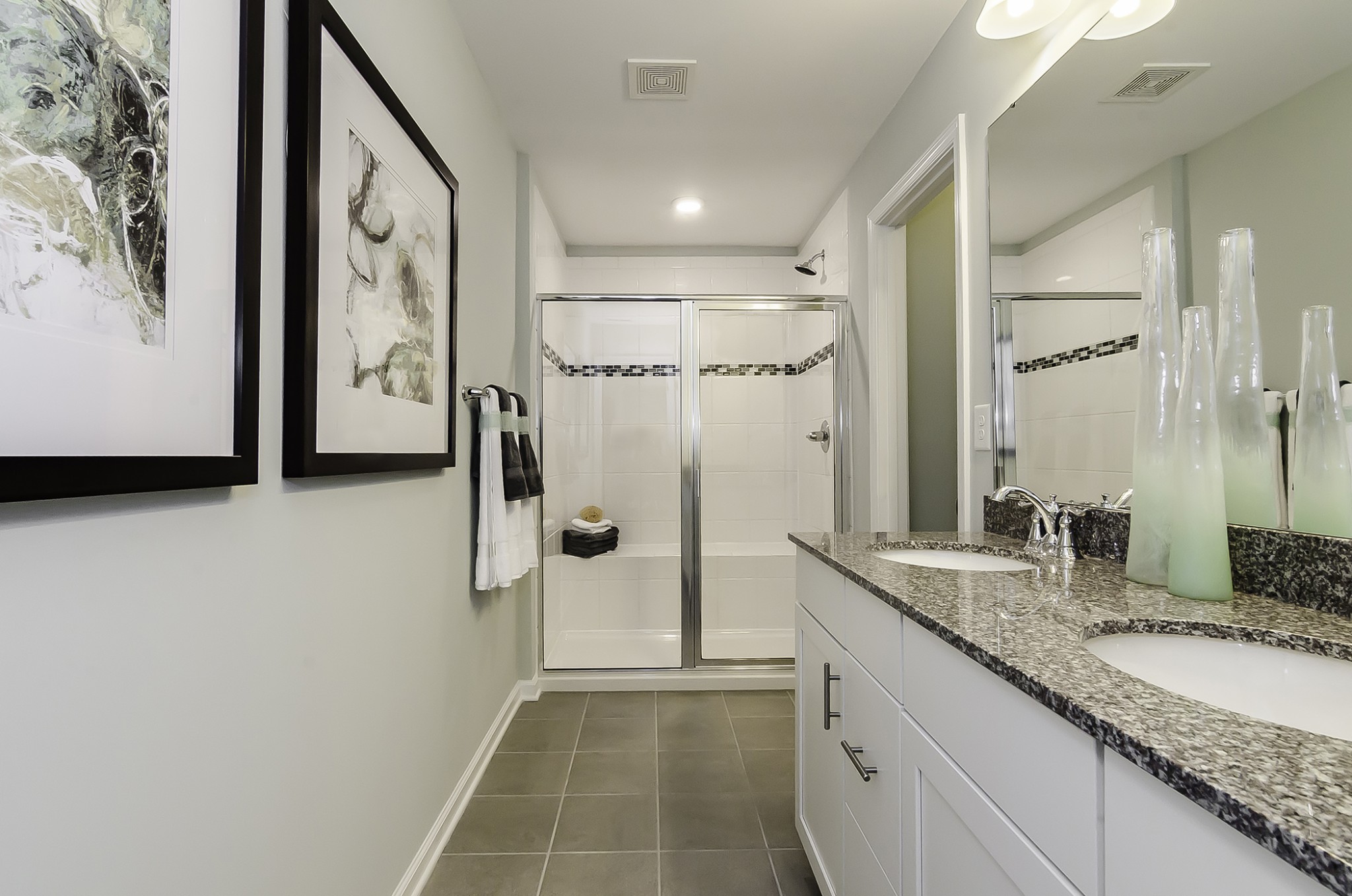 118 Keelon Gap Road Spring Hill, TN 37174 - Photo 3 of 11 a bathroom with a granite countertop sink a mirror and shower