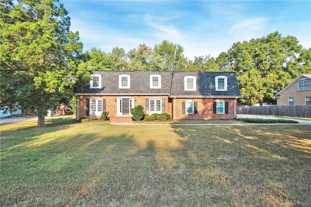 4312 Carmel Road Charlotte, NC 28226 - Photo 1 of 36 a front view of a house with a yard and garage