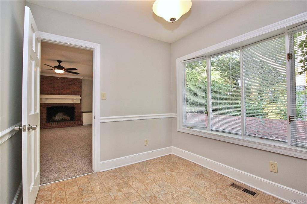 4312 Carmel Road Charlotte, NC 28226 - Photo 11 of 36 wooden floor in an empty room with a window