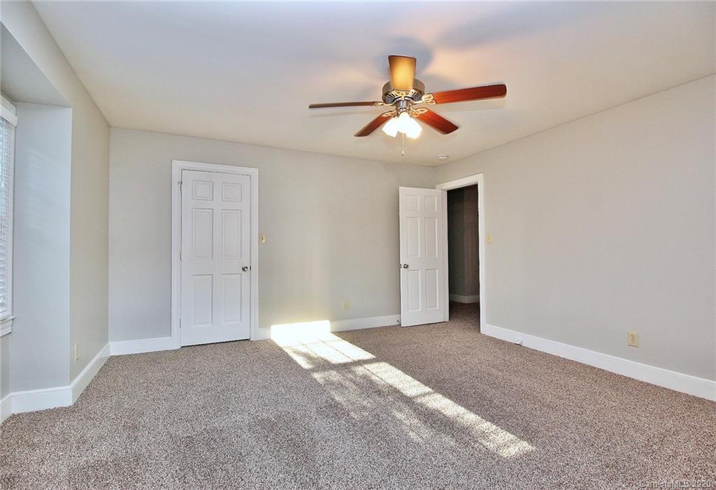 4312 Carmel Road Charlotte, NC 28226 - Photo 16 of 36 a view of an empty room with a window