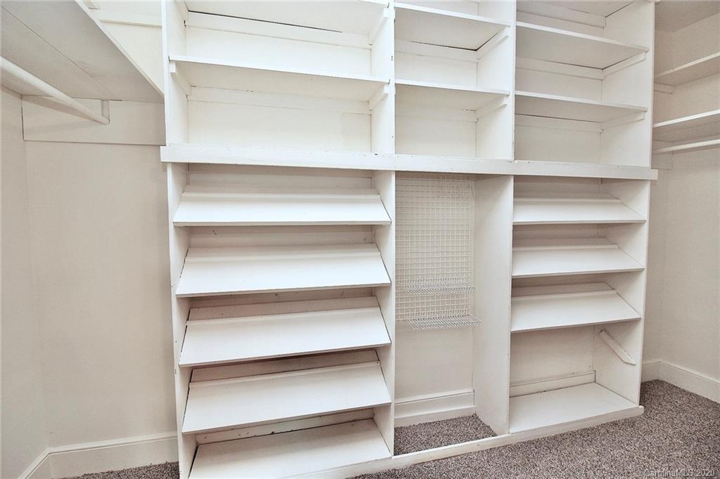 4312 Carmel Road Charlotte, NC 28226 - Photo 18 of 36 a view of walk in closet with empty racks