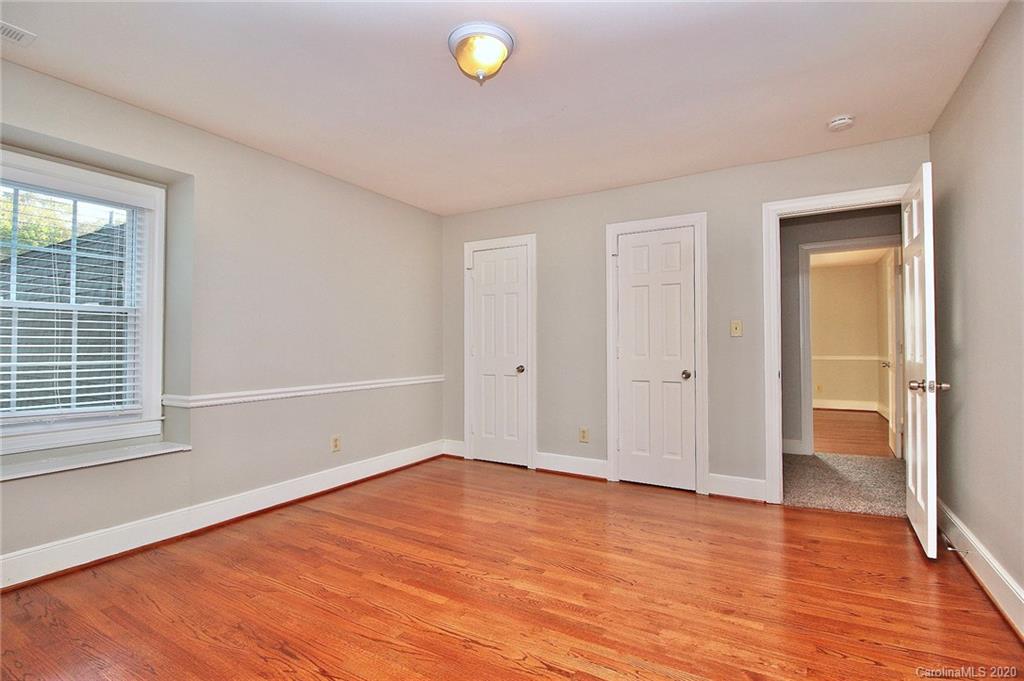 4312 Carmel Road Charlotte, NC 28226 - Photo 24 of 36 a view of empty room with wooden floor and fan