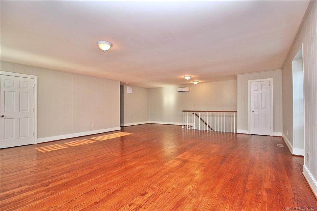 4312 Carmel Road Charlotte, NC 28226 - Photo 25 of 36 a view of an empty room with wooden floor