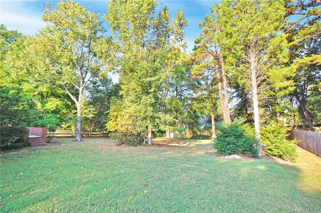 4312 Carmel Road Charlotte, NC 28226 - Photo 29 of 36 a view of outdoor space with deck and trees