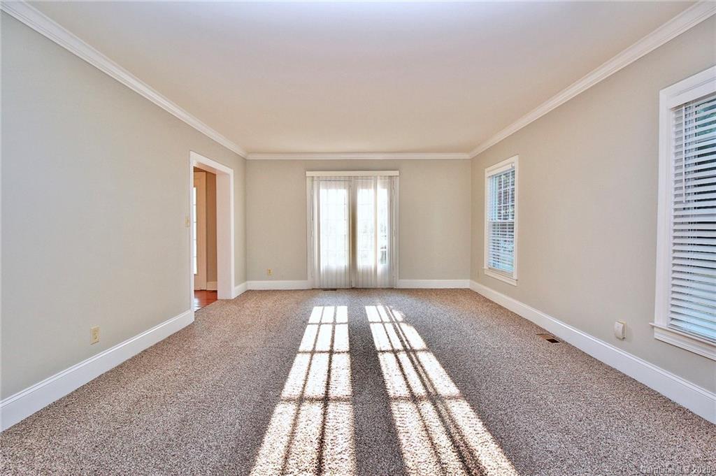 4312 Carmel Road Charlotte, NC 28226 - Photo 4 of 36 an empty room with windows