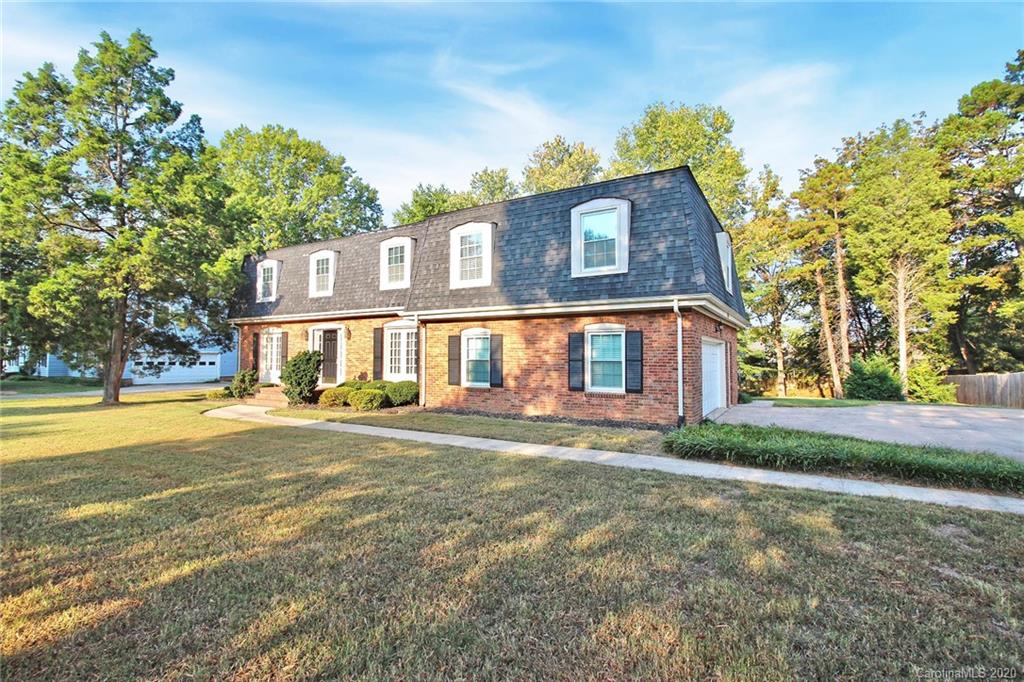4312 Carmel Road Charlotte, NC 28226 - Photo 35 of 36 a front view of a house with a yard and outdoor seating
