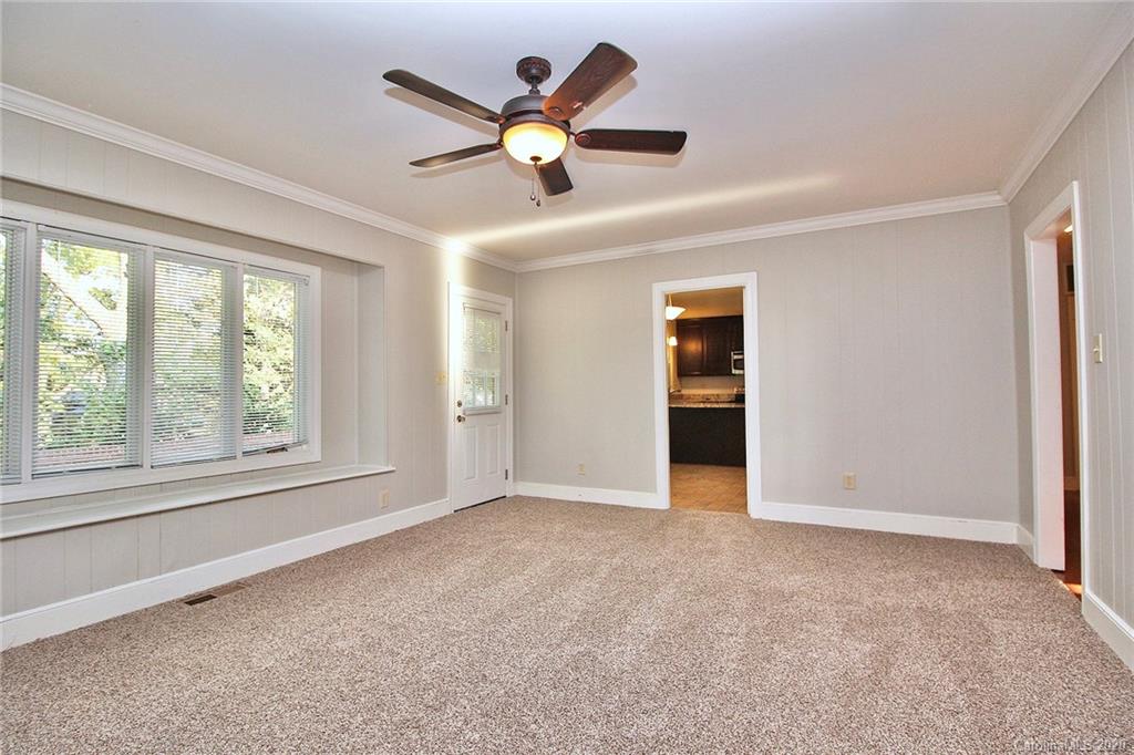 4312 Carmel Road Charlotte, NC 28226 - Photo 5 of 36 an empty room with fan and windows