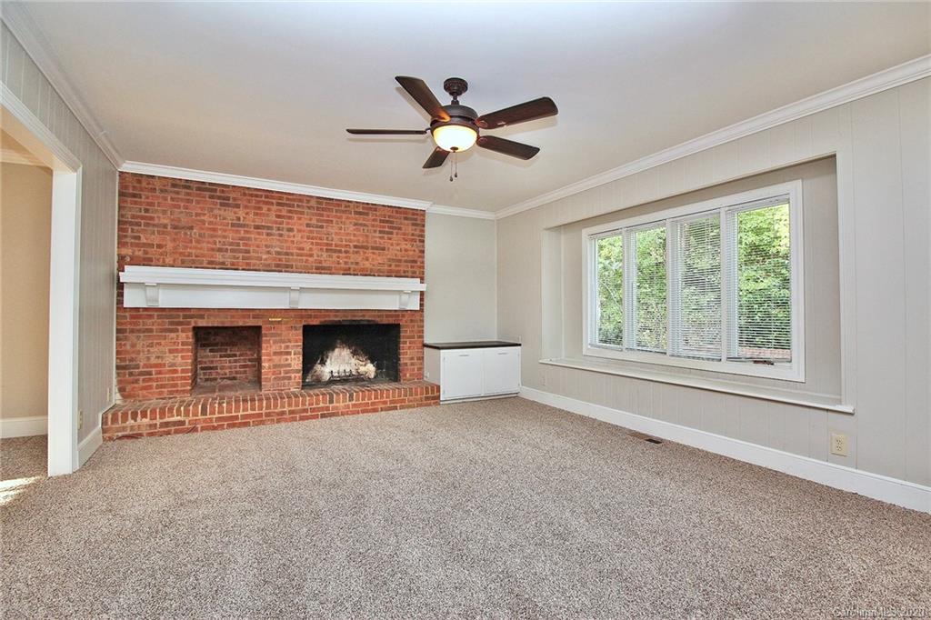 4312 Carmel Road Charlotte, NC 28226 - Photo 6 of 36 a view of empty room with fan and windows