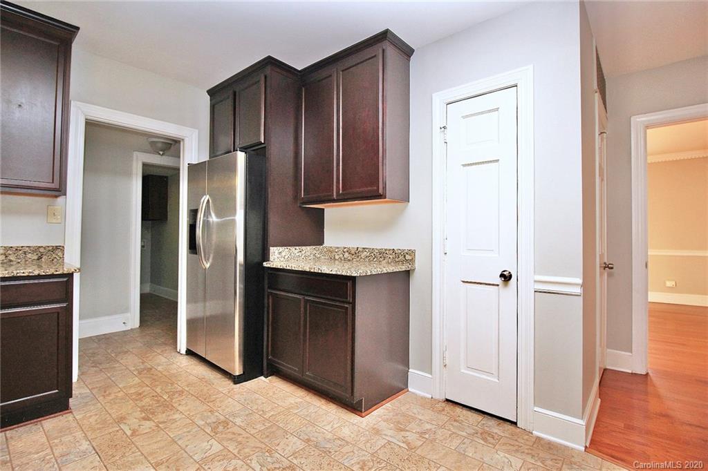 4312 Carmel Road Charlotte, NC 28226 - Photo 8 of 36 a kitchen with stainless steel appliances granite countertop a refrigerator and a sink