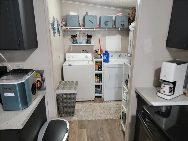 a bedroom with furniture and a wooden floor