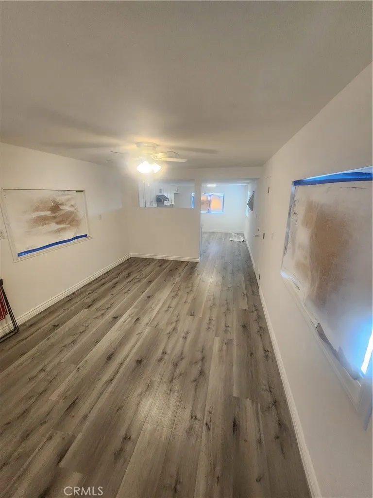 3319 Avalon Street, Unit 78 Riverside, CA 92509 - Photo 12 of 37 a view of a hallway with wooden floor