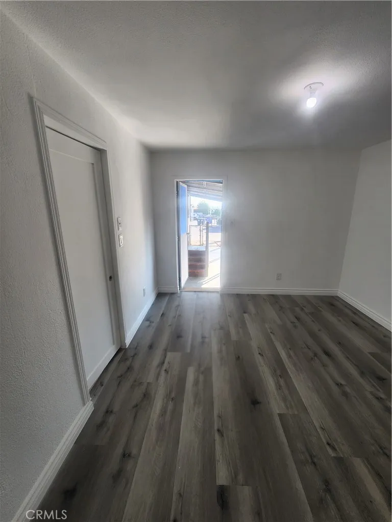 3319 Avalon Street, Unit 78 Riverside, CA 92509 - Photo 15 of 37 wooden floor in a hall with an empty room