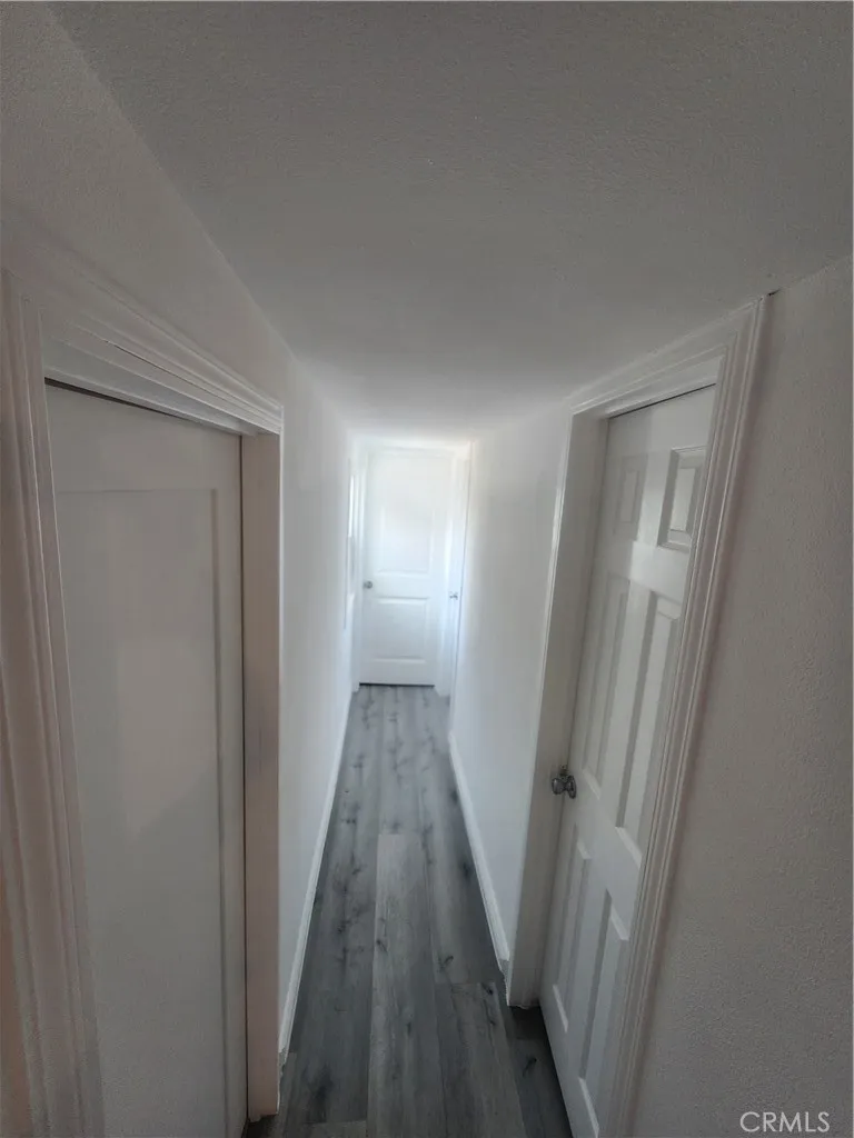 3319 Avalon Street, Unit 78 Riverside, CA 92509 - Photo 18 of 37 a view of a hallway with wooden floor