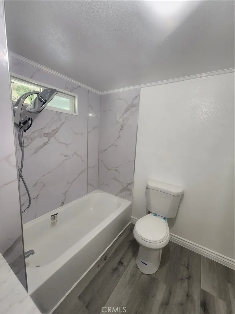 3319 Avalon Street, Unit 78 Riverside, CA 92509 - Photo 31 of 37 a bathroom with a toilet and a shower