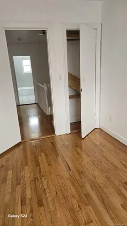 a view of livingroom and hardwood floor