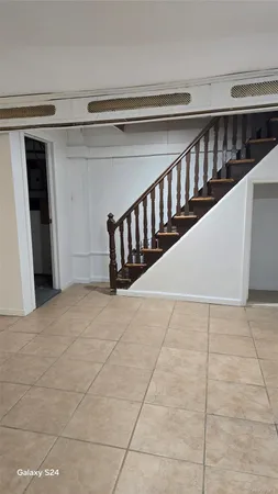 a view of an empty room with stairs