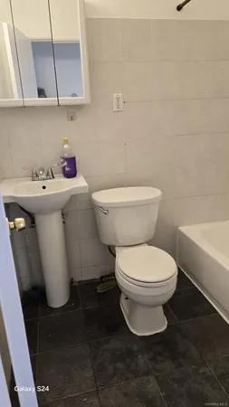 a bathroom with a sink and toilet