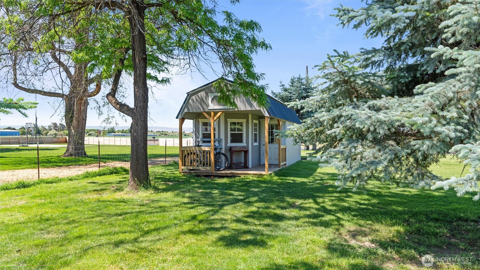 457 McKinney Road Walla Walla, WA 99362 - Photo 28 of 29 a view of a house with a small yard and a large tree