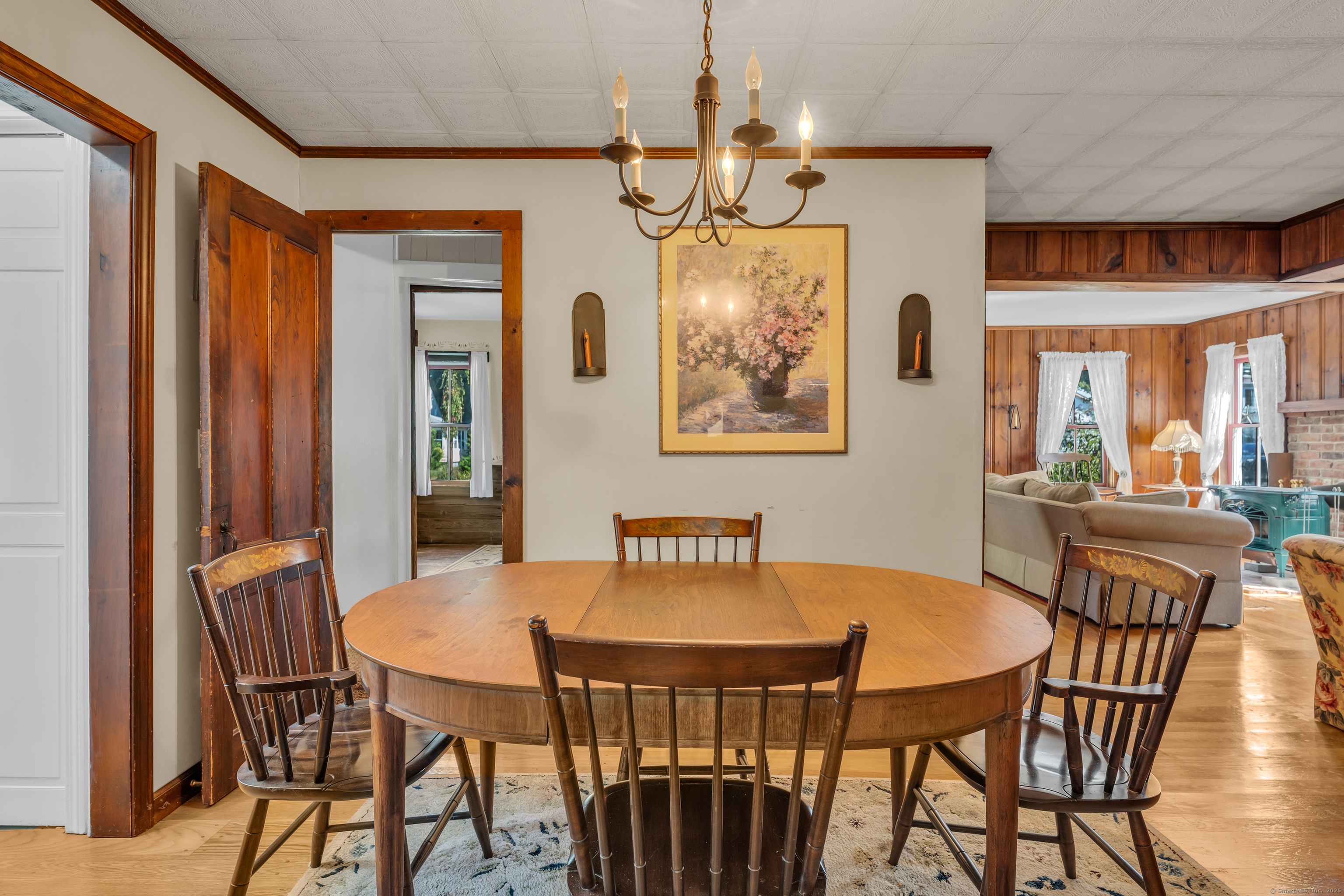 13 Waterside Lane Clinton, CT 06413 - Photo 17 of 40 a view of a dining room with furniture and a chandelier
