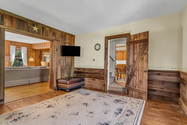 a living room with a couch and a dresser