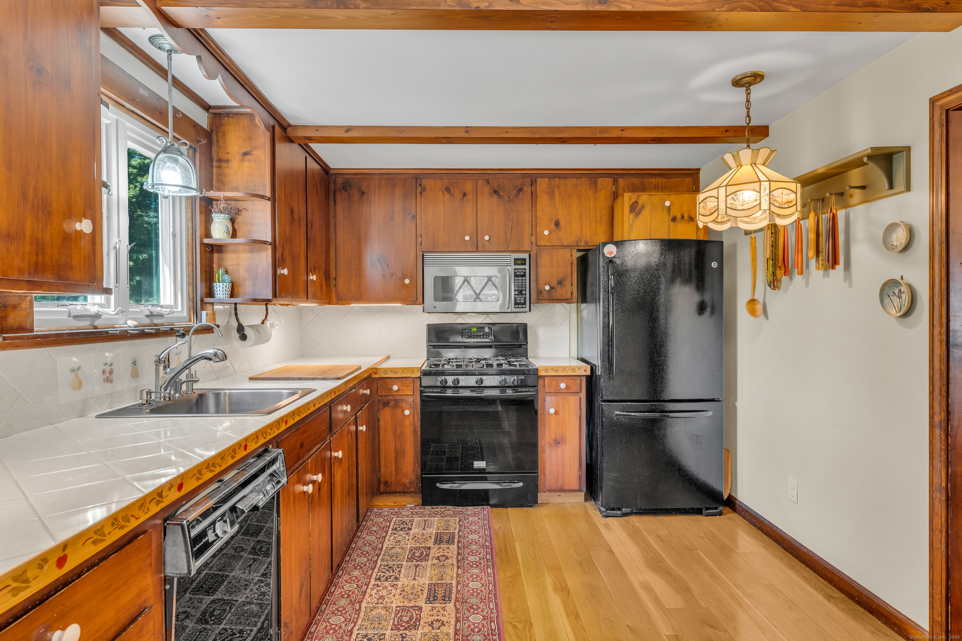 13 Waterside Lane Clinton, CT 06413 - Photo 22 of 40 a kitchen with stainless steel appliances granite countertop a refrigerator and a sink