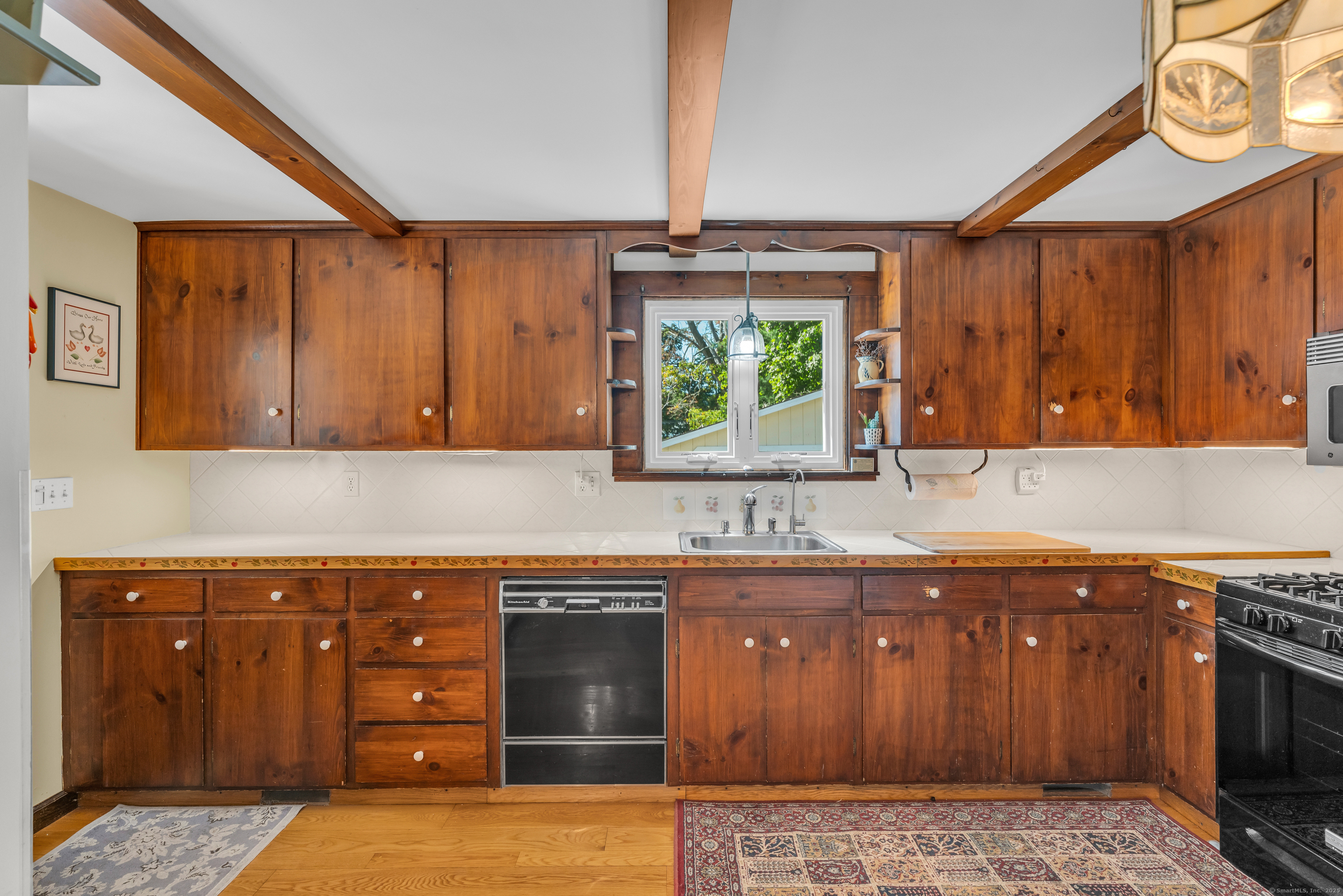 13 Waterside Lane Clinton, CT 06413 - Photo 23 of 40 a kitchen with a sink and a stove top oven