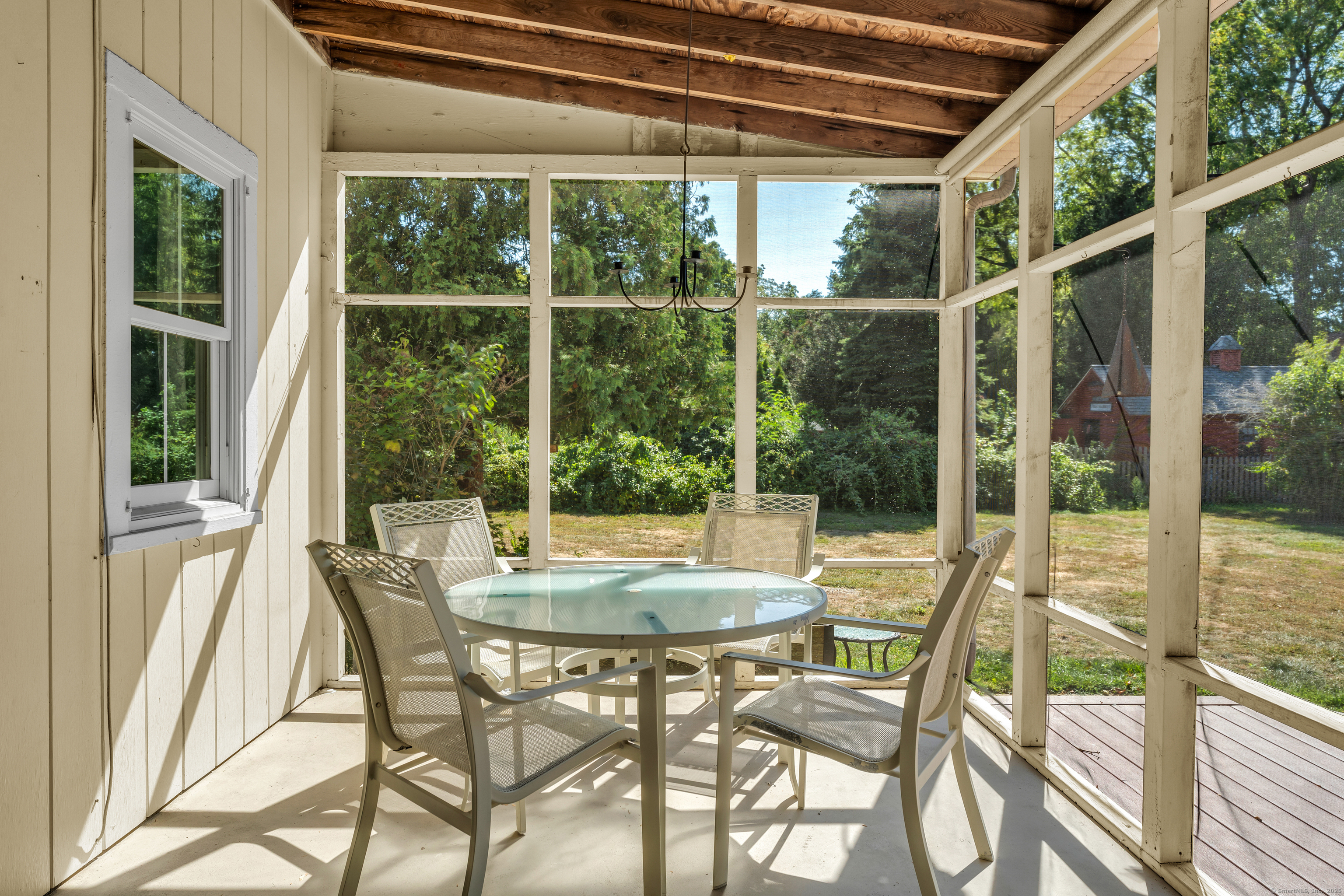 13 Waterside Lane Clinton, CT 06413 - Photo 10 of 40 a view of an outdoor space with a table and chairs