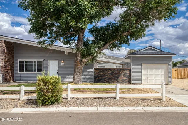 a house with trees in the background