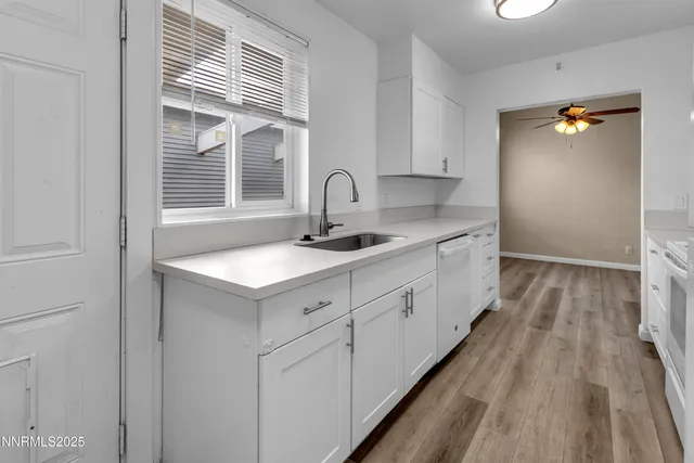 a spacious bathroom with a sink and mirror