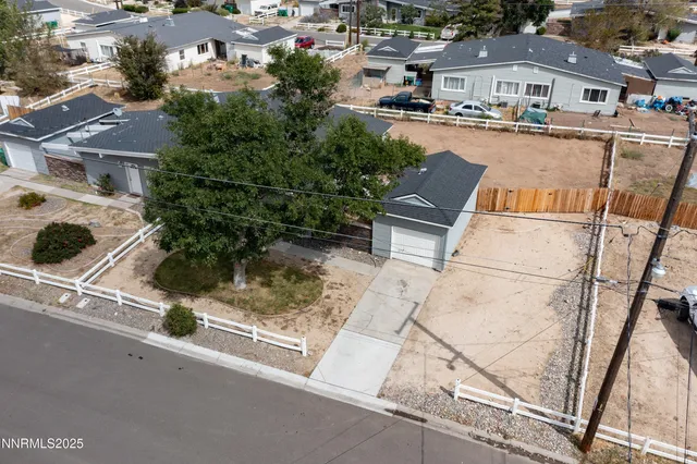 an aerial view of residential houses with outdoor space
