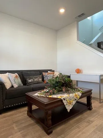 a living room with furniture and a table