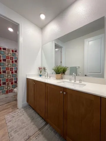 a view of backyard and wooden fence