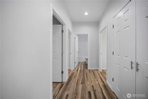 a view of a bathroom from a hallway