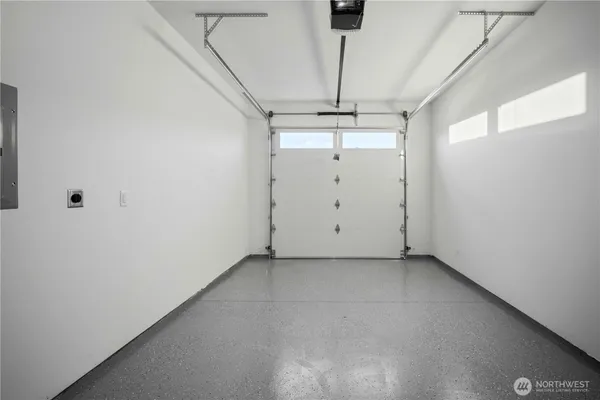 a view of a room with a ceiling fan