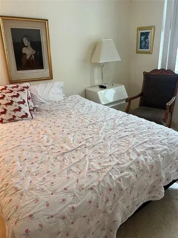 a living room with couches and a flat screen tv