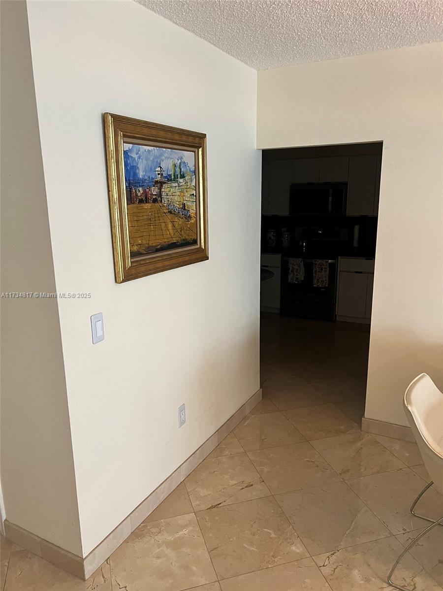 9801 Collins Avenue, Unit 17J Bal Harbour, FL 33154 - Photo 15 of 34 a view of a hallway