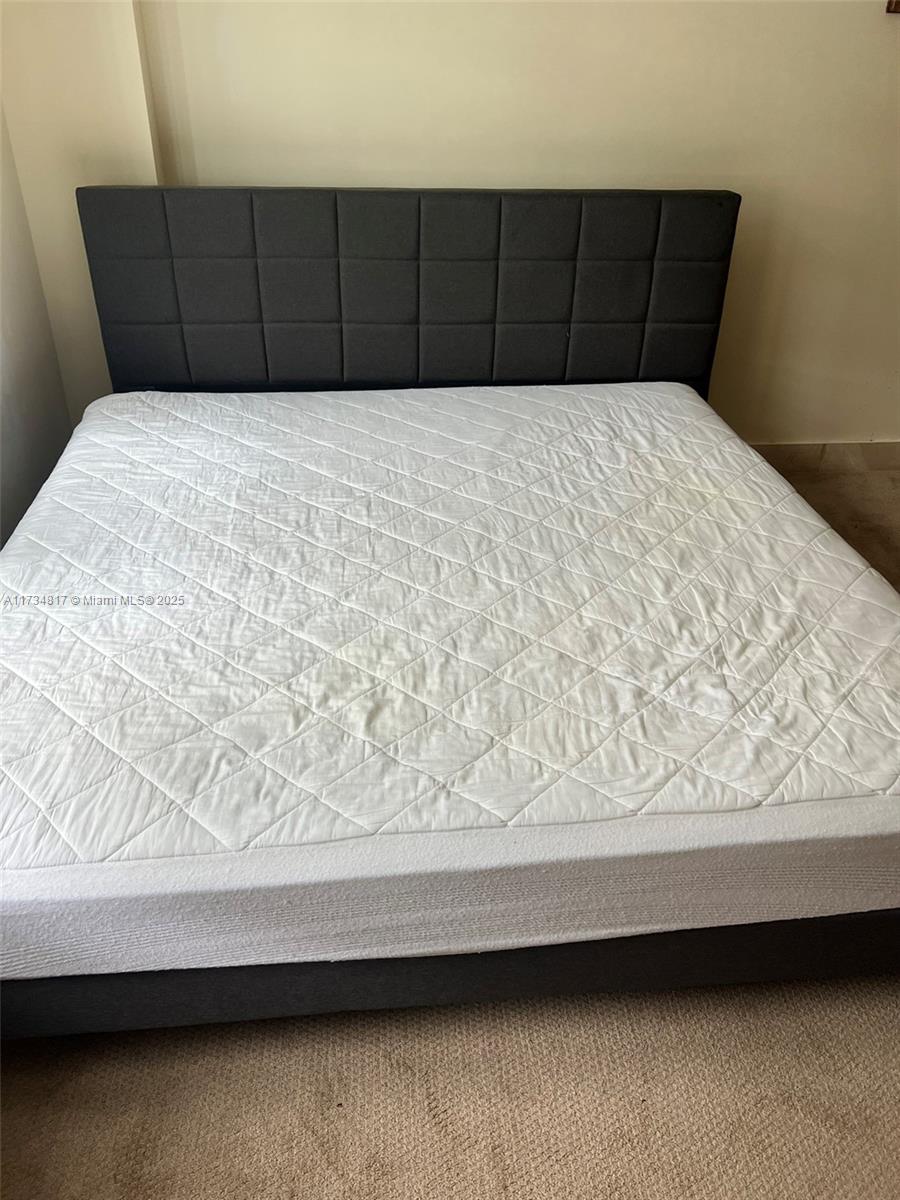 9801 Collins Avenue, Unit 17J Bal Harbour, FL 33154 - Photo 18 of 34 a view of a bed in a bedroom