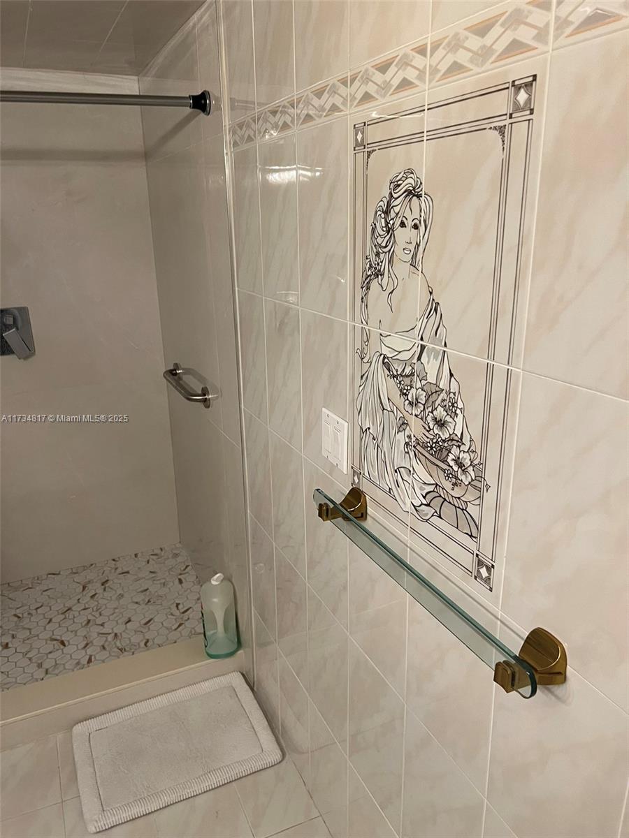9801 Collins Avenue, Unit 17J Bal Harbour, FL 33154 - Photo 21 of 34 a bathroom with a shower