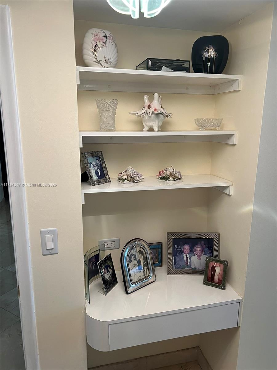 9801 Collins Avenue, Unit 17J Bal Harbour, FL 33154 - Photo 22 of 34 a view of dining room with books