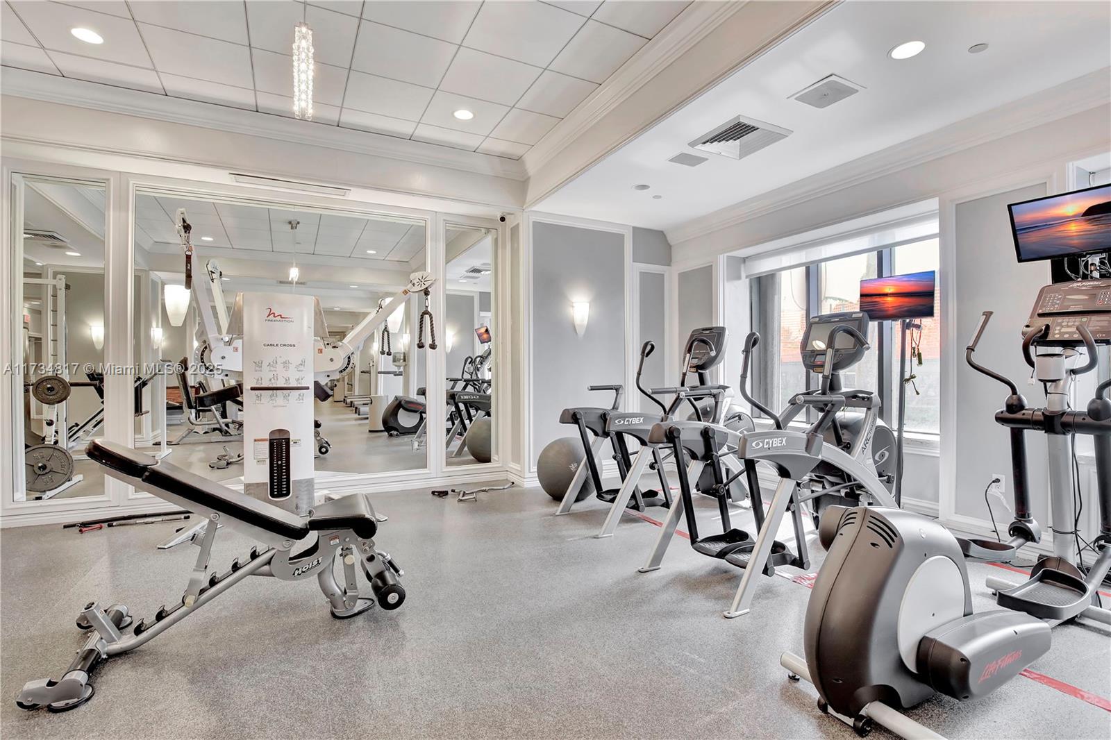 9801 Collins Avenue, Unit 17J Bal Harbour, FL 33154 - Photo 30 of 34 a view of a room with gym equipment