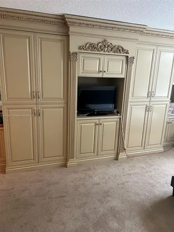 a view of a kitchen with furniture and a fireplace