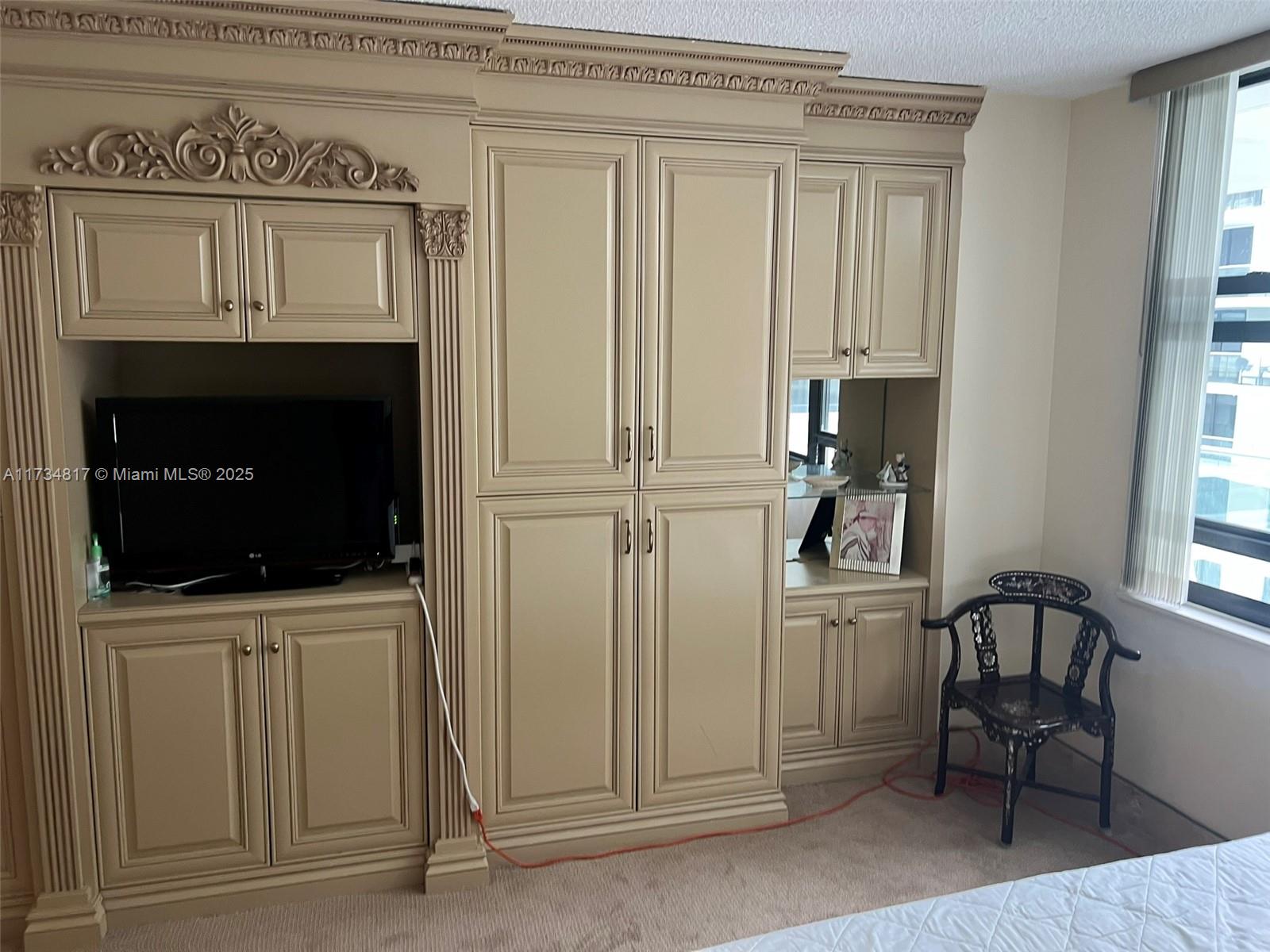 9801 Collins Avenue, Unit 17J Bal Harbour, FL 33154 - Photo 6 of 34 a view of a kitchen with furniture and a fireplace