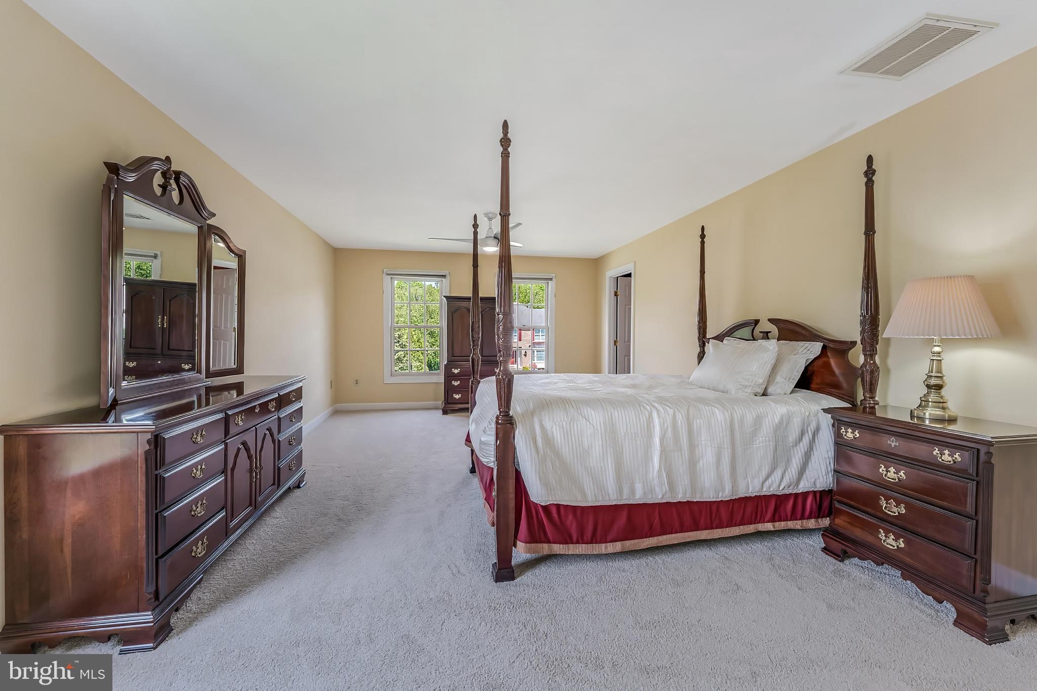 5501 Ashleigh Road Fairfax, VA 22030 - Photo 43 of 77 a spacious bedroom with a bed and dresser