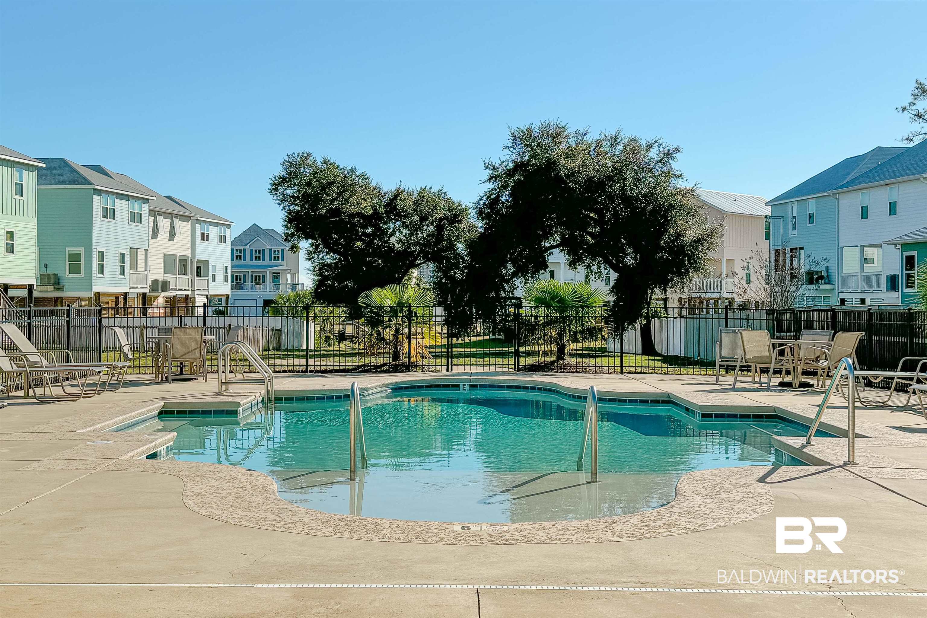 1290 Mako Loop Gulf Shores, AL 36542 - Photo 48 of 50 Community pool featuring a patio area, a residential view, and fence
