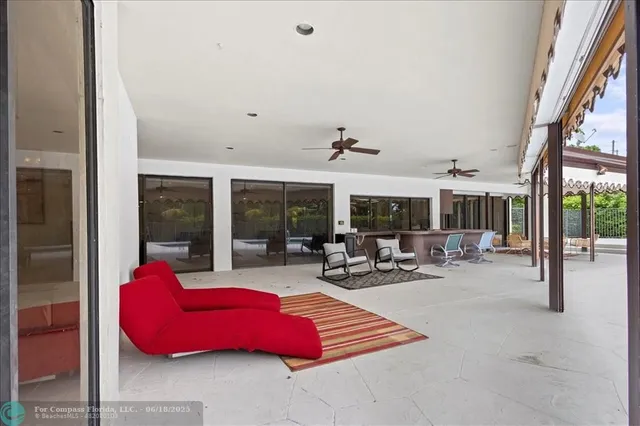 a kitchen with a large window and a sink