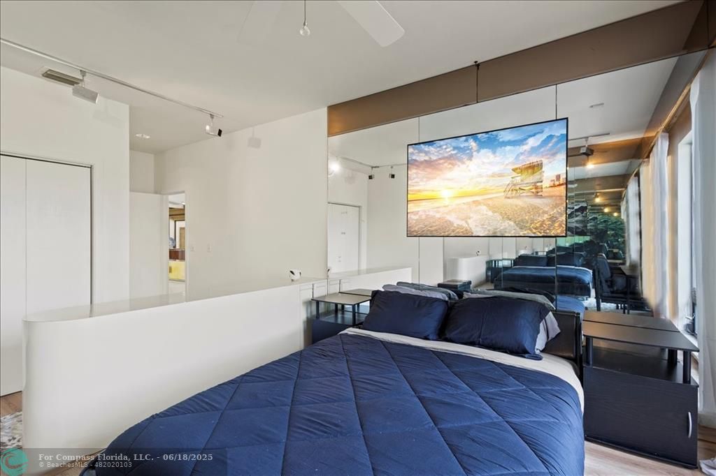 5304 Woodlands Boulevard Tamarac, FL 33319 - Photo 25 of 57 a living room with furniture and a flat screen tv