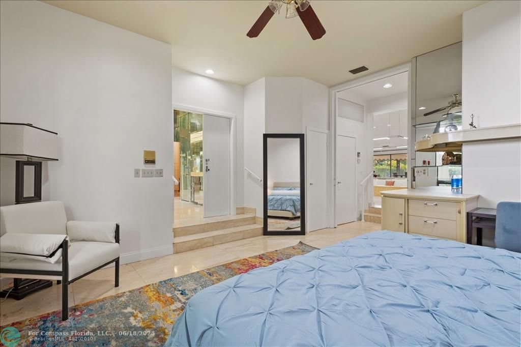 5304 Woodlands Boulevard Tamarac, FL 33319 - Photo 32 of 57 a bedroom with a bed and a couch